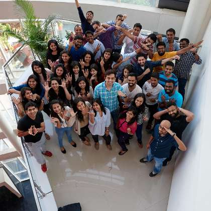Photo of C-Drive Tech   's team with their laptops discussing a project